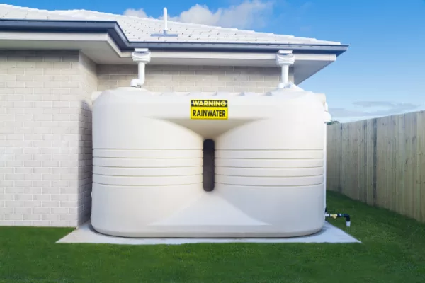 Large rain water tank in suburban backyard jpg